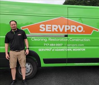 Operations Manager Brian Dougherty standing at the rear of the SERVPRO Adamstown Promaster Van 