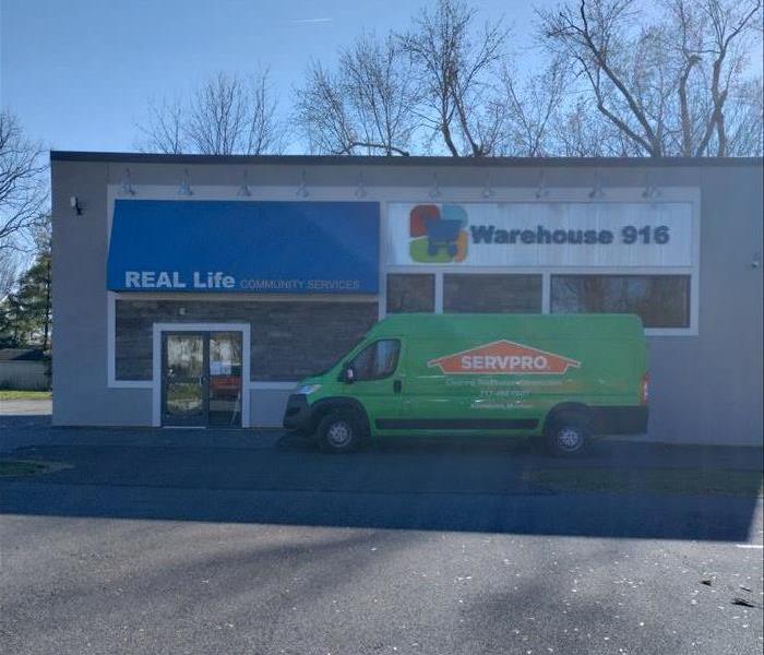 SERVPRO Adamstown Mohnton Van parked in front of Real Life Community Services warehouse